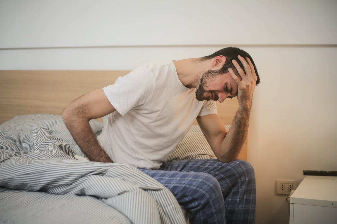 man experiencing a severe migraine