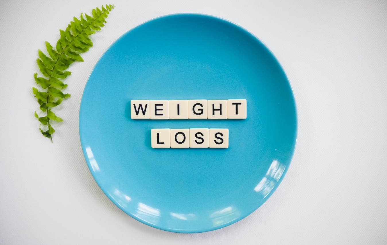 A sign reading weight-loss