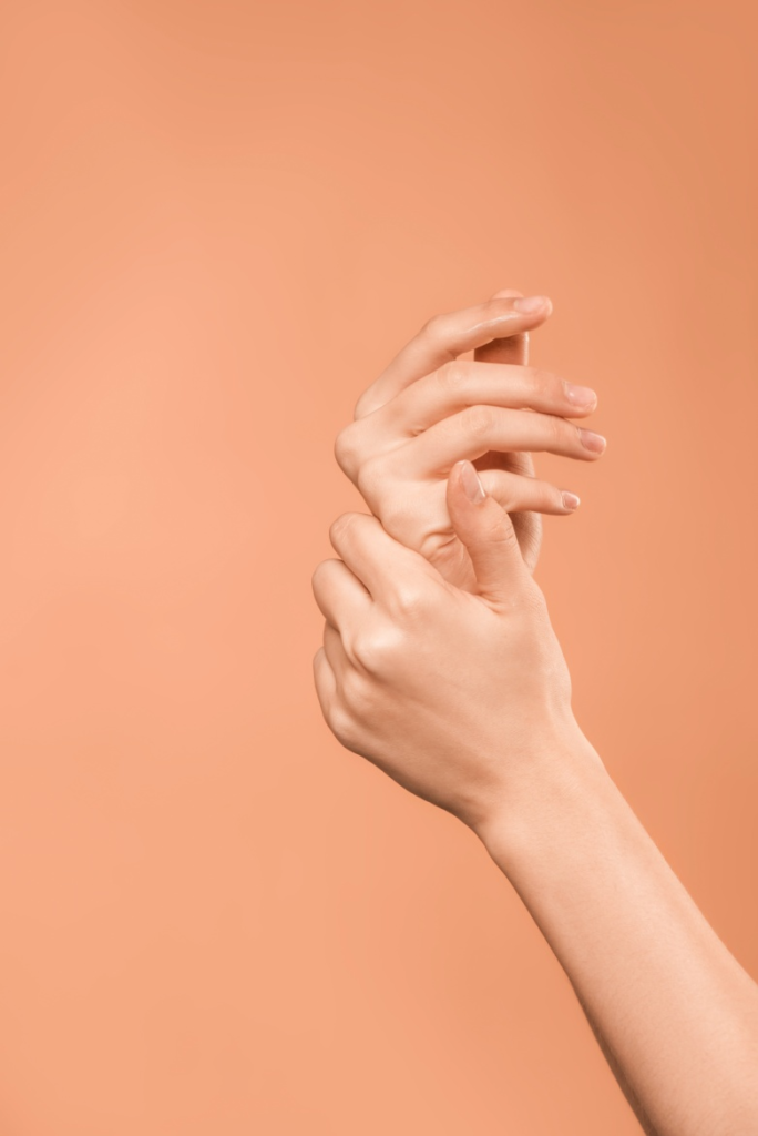 Woman moisturizing hands with Chaga Body Butter 